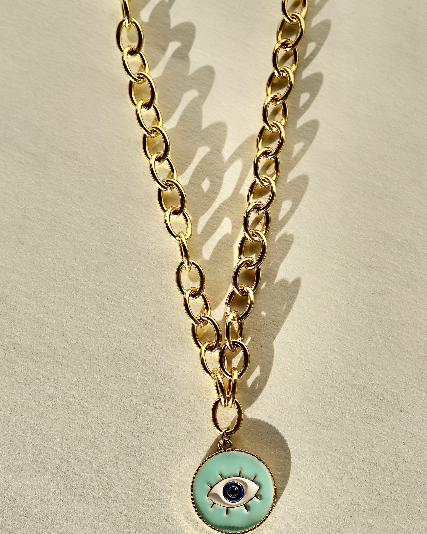 Collar Dorado con Dije Redondo de Ojo Protector en Turquesa